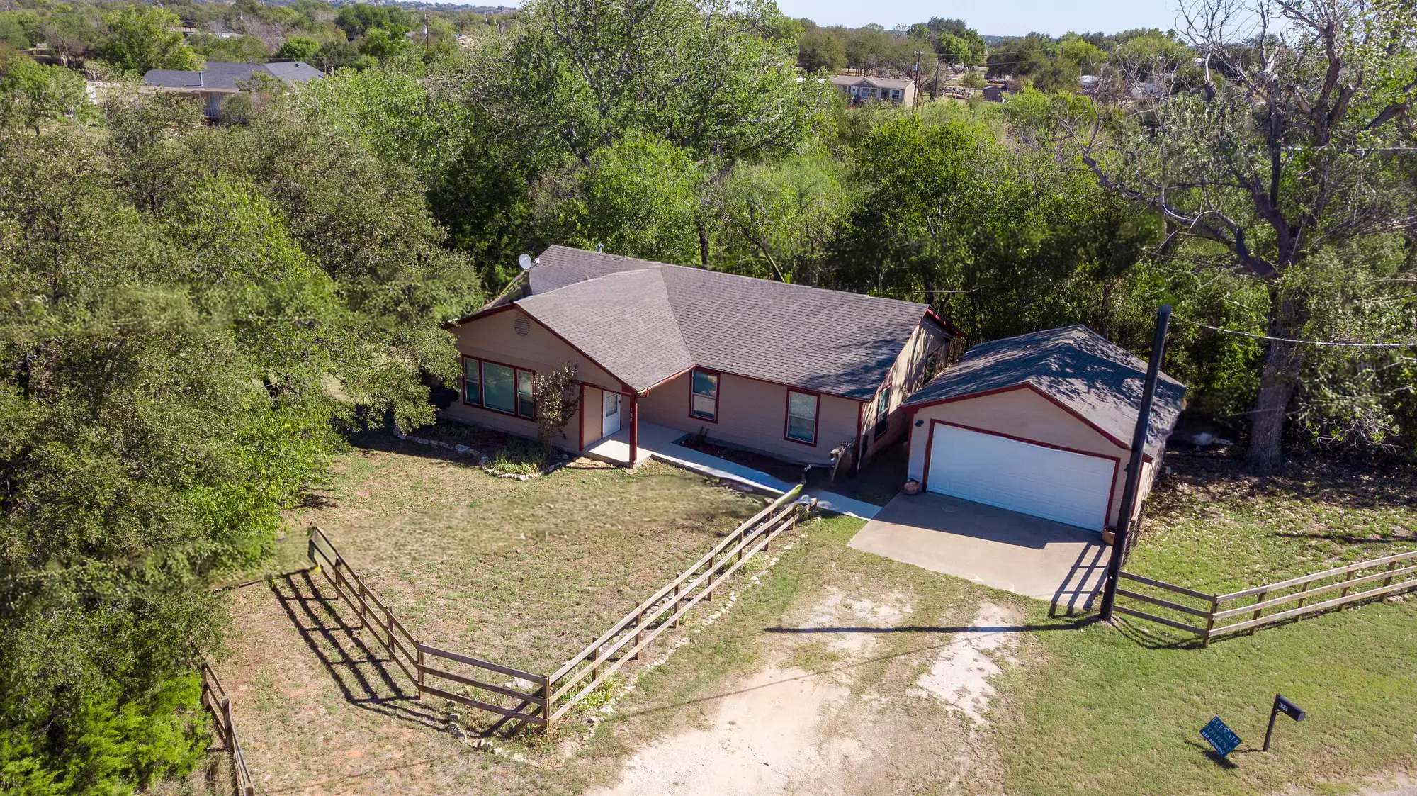 Drone real estate photography showing a Granbury property and surrounding land