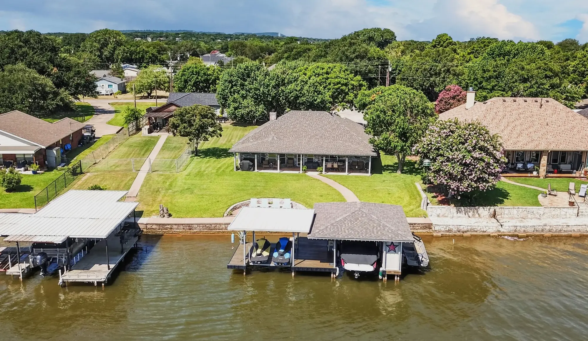 Waterfront drone photo of 1803 Chisec Court and dock access in Granbury Texas